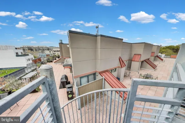 a view of a balcony with chairs