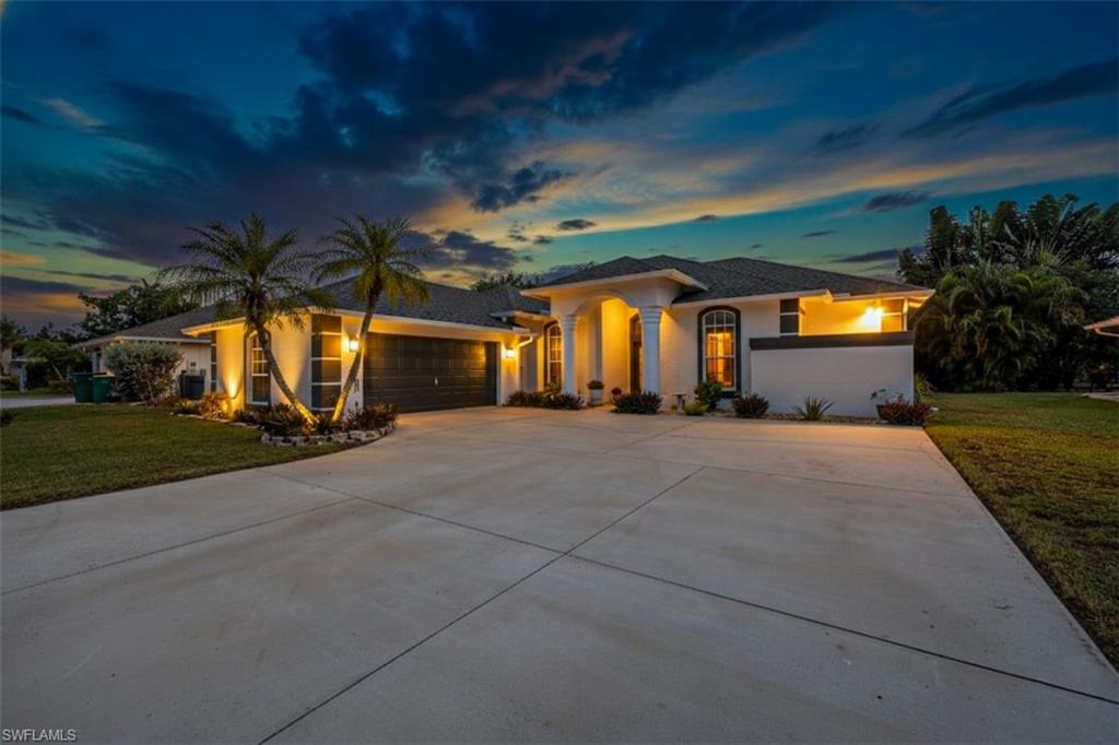 496 Raven Way Naples, FL 34110 - Photo 1 of 31 a view of a house with a patio