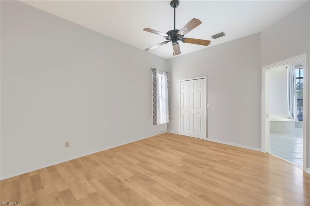 496 Raven Way Naples, FL 34110 - Photo 14 of 31 a view of a room with a ceiling fan