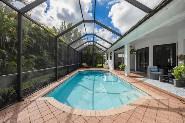 a view of a swimming pool with a patio