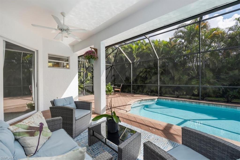 496 Raven Way Naples, FL 34110 - Photo 27 of 31 a room with pool table and a large window