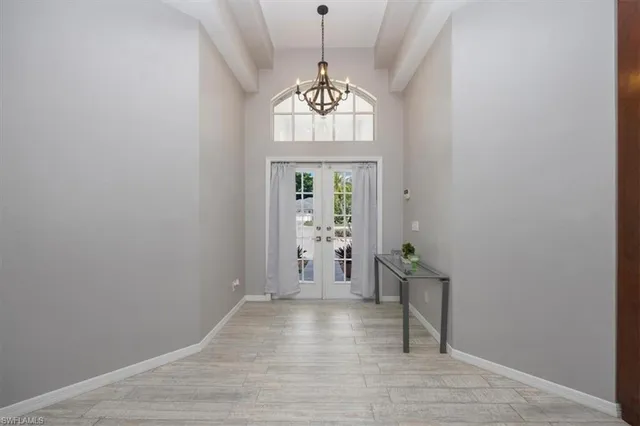 a view of an entryway with wooden floor