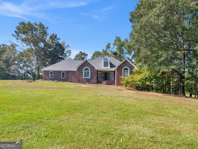 a kitchen with stainless steel appliances granite countertop a sink a stove and cabinets