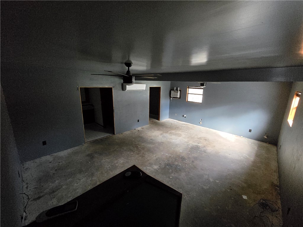 305 East Laredo Street Freer, TX 78357 - Photo 12 of 19 a view of a livingroom with a kitchen