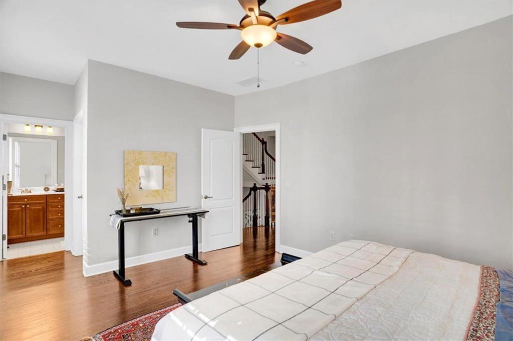 188 Centennial Way Atlanta, GA 30313 - Photo 16 of 30 a bedroom with a bed and a chandelier