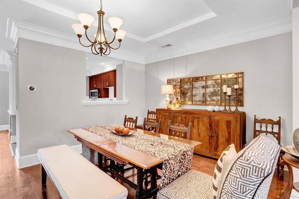 188 Centennial Way Atlanta, GA 30313 - Photo 5 of 30 a living room with furniture a chandelier and a dining table