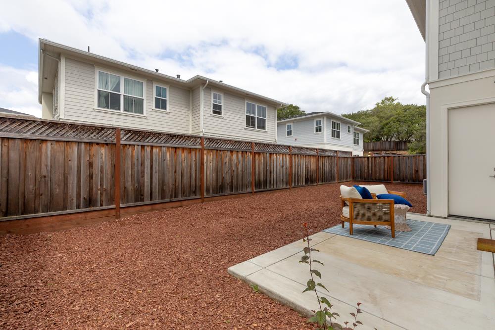 103 Staggi Lane Soquel, CA 95073 - Photo 29 of 35 a backyard of a house with table and chairs