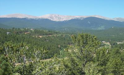 144 Hall Road Bailey, CO 80421 - Photo 1 of 1 a view of a town with mountains in the background