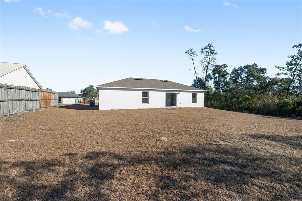 4400 Southwest 155th Street Ocala, FL 34473 - Photo 11 of 41 a view of a house with a backyard