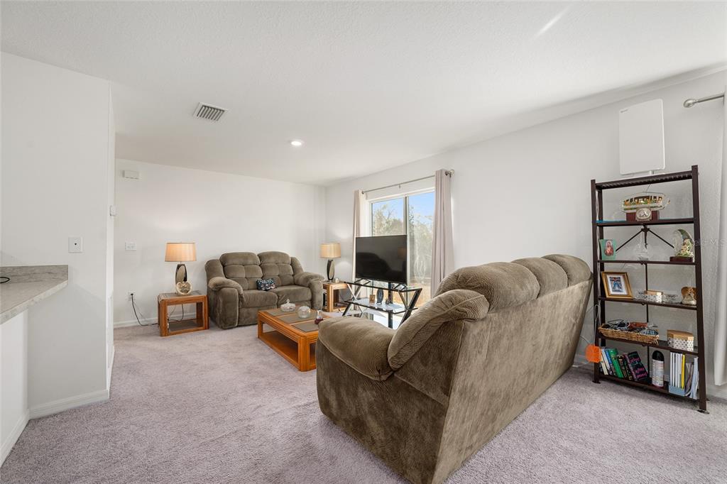 4400 Southwest 155th Street Ocala, FL 34473 - Photo 16 of 41 a living room with furniture and a couch