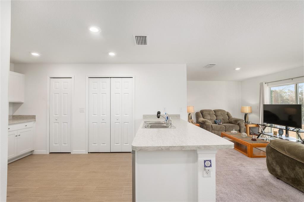 4400 Southwest 155th Street Ocala, FL 34473 - Photo 22 of 41 a room with a couch and a flat screen tv