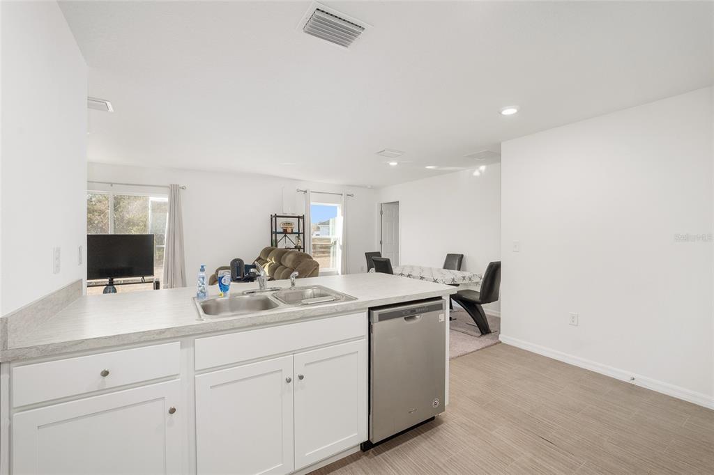 4400 Southwest 155th Street Ocala, FL 34473 - Photo 25 of 41 a view of a sink and dishwasher with cabinets