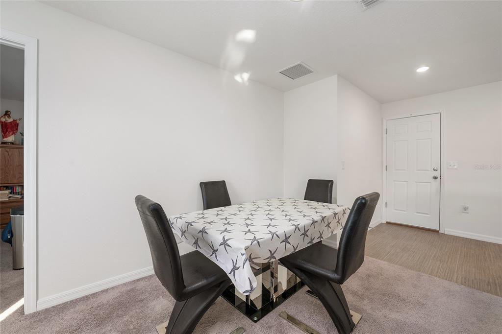 4400 Southwest 155th Street Ocala, FL 34473 - Photo 27 of 41 a view of a dining room with furniture