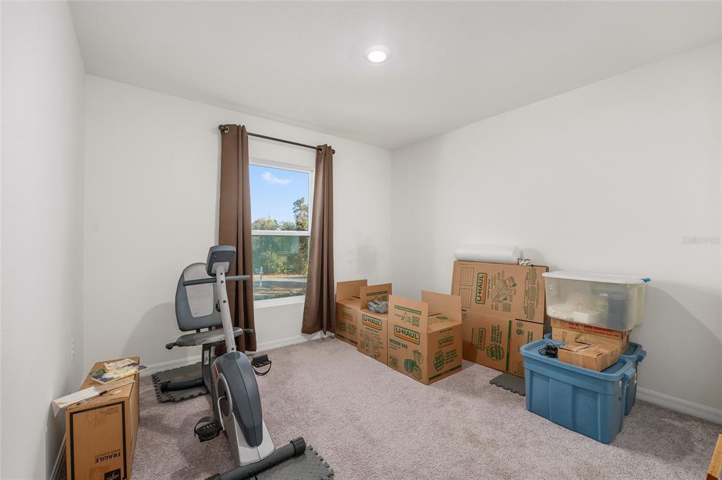 4400 Southwest 155th Street Ocala, FL 34473 - Photo 30 of 41 a view of a workspace with furniture and a window