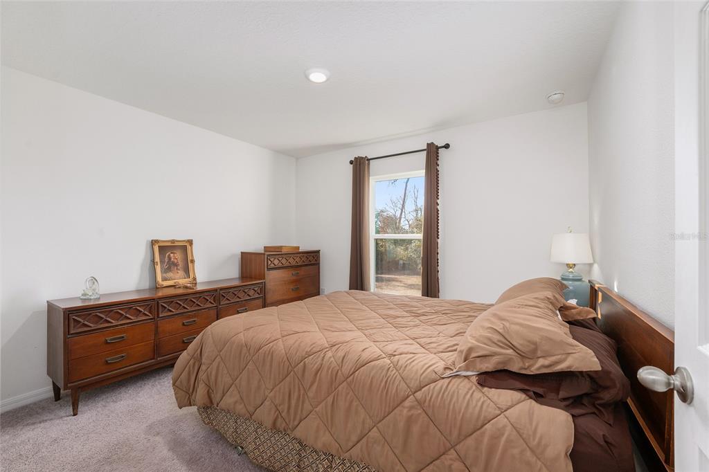 4400 Southwest 155th Street Ocala, FL 34473 - Photo 33 of 41 a bedroom with a bed and a closet