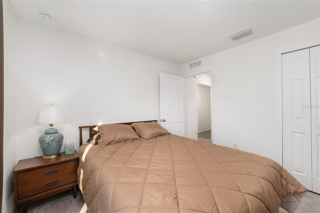 4400 Southwest 155th Street Ocala, FL 34473 - Photo 34 of 41 a bedroom with a bed and a cabinets