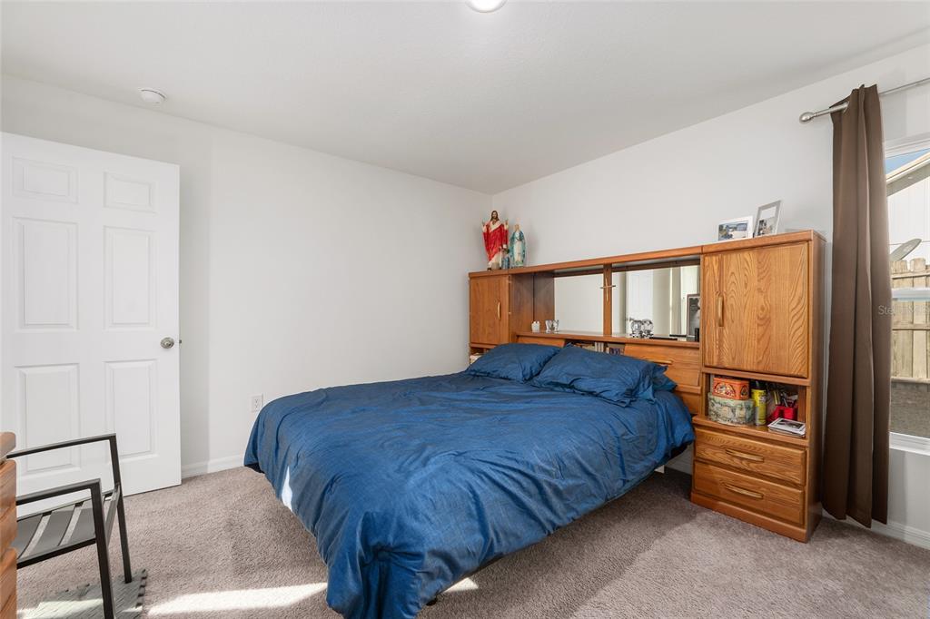 4400 Southwest 155th Street Ocala, FL 34473 - Photo 38 of 41 a bedroom with a bed and a window