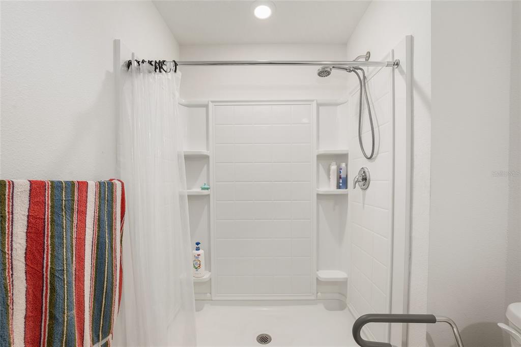 4400 Southwest 155th Street Ocala, FL 34473 - Photo 41 of 41 a bathroom with a shower and a mirror