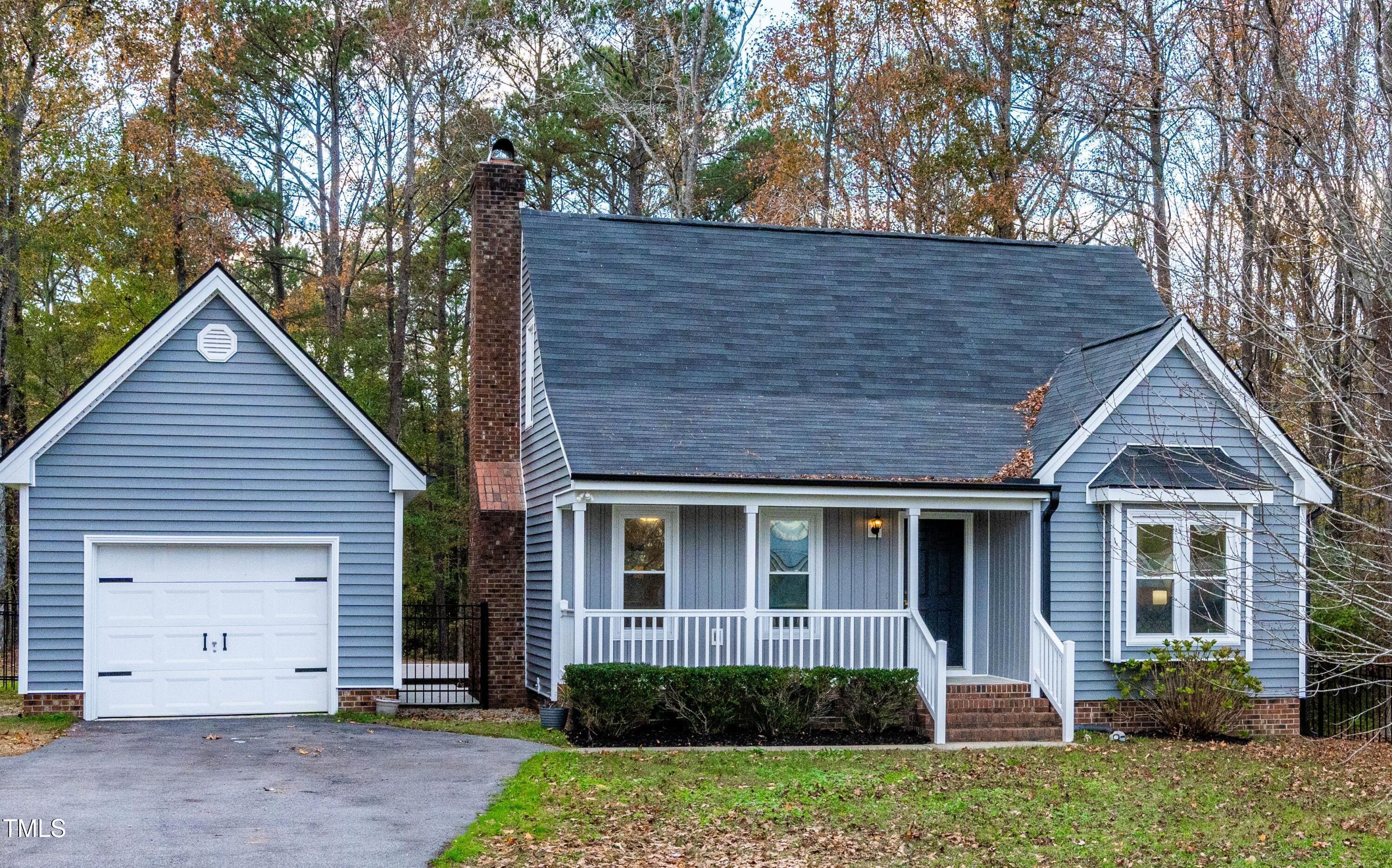 1862 Ranch Road Clayton, NC 27520 - Photo 1 of 26 a view of a house with a yard and plants