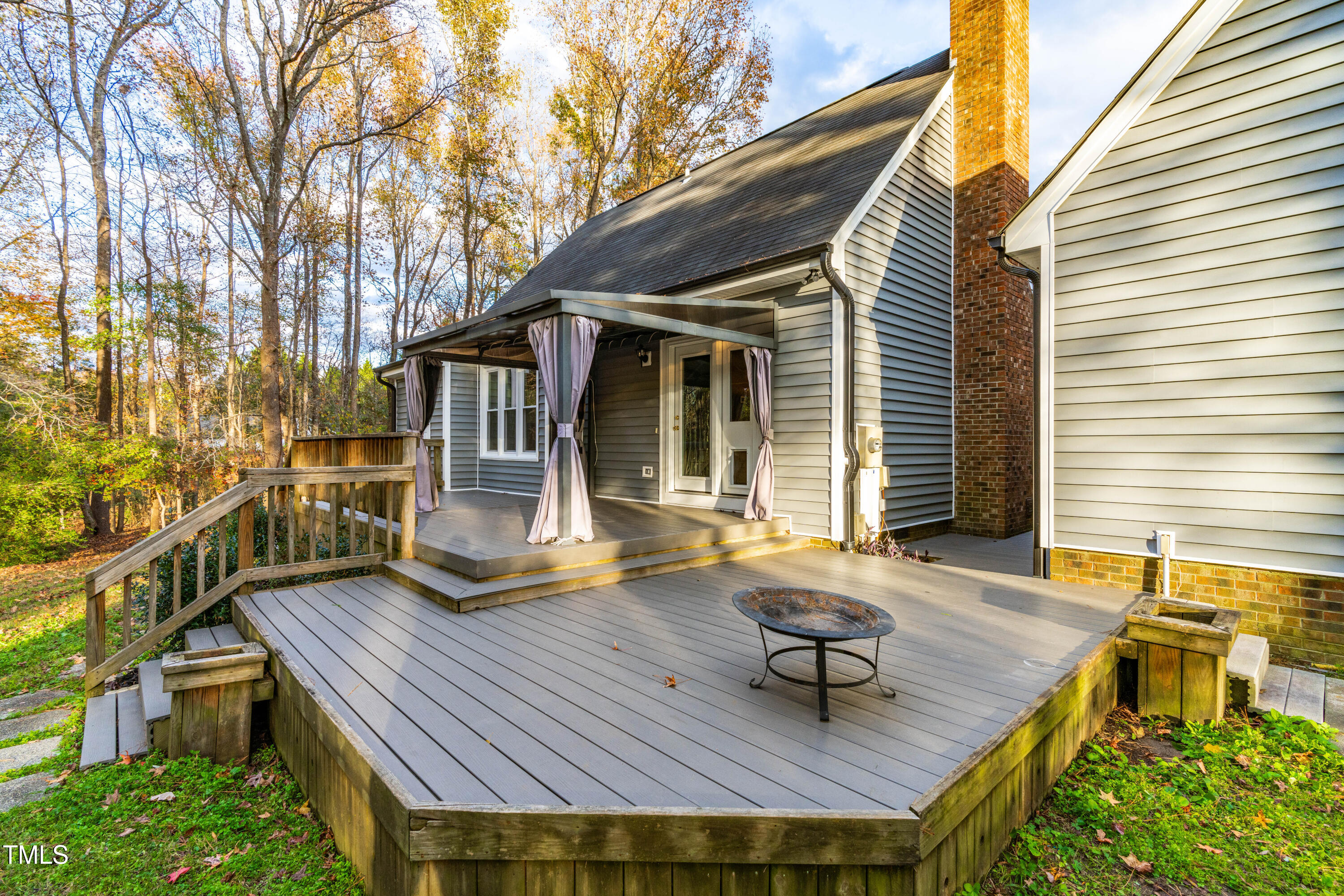 1862 Ranch Road Clayton, NC 27520 - Photo 21 of 26 a view of backyard with deck and outdoor seating