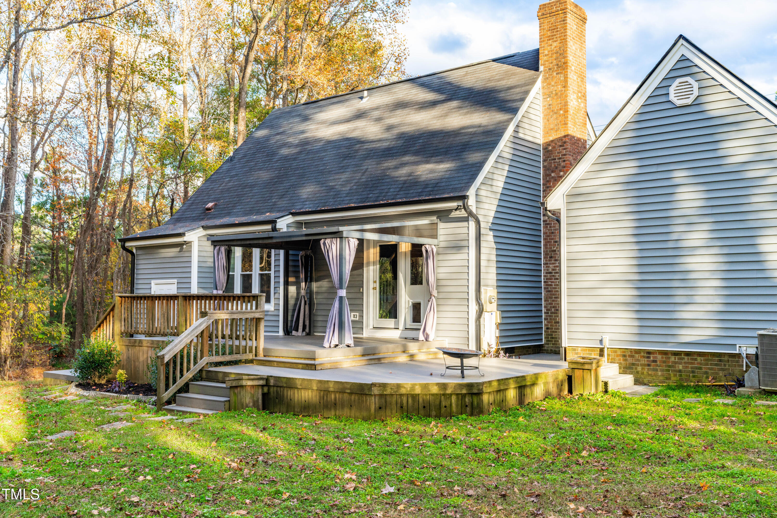 1862 Ranch Road Clayton, NC 27520 - Photo 23 of 26 a front view of house with a garden and swimming pool