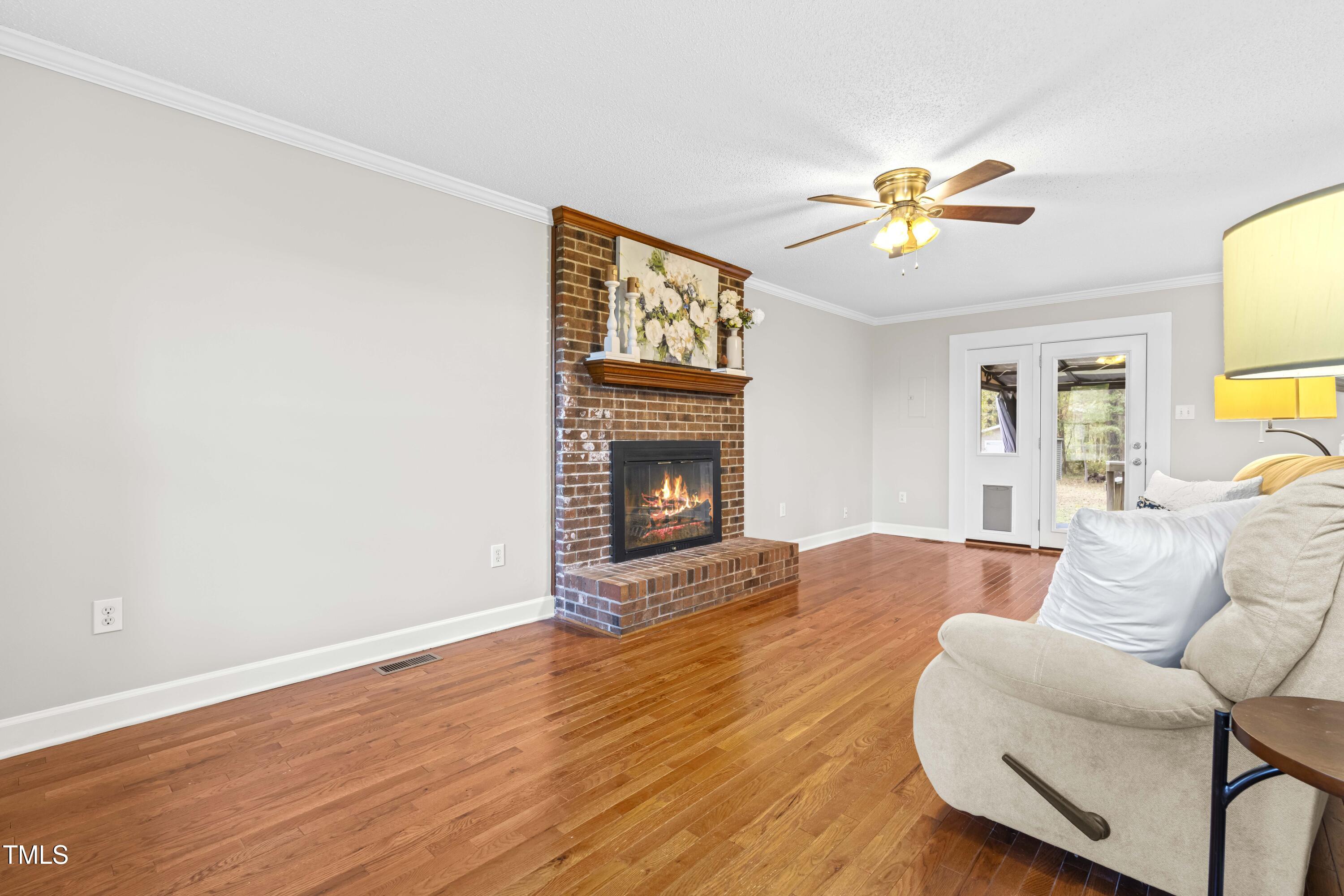 1862 Ranch Road Clayton, NC 27520 - Photo 4 of 26 a living room with furniture and a fireplace