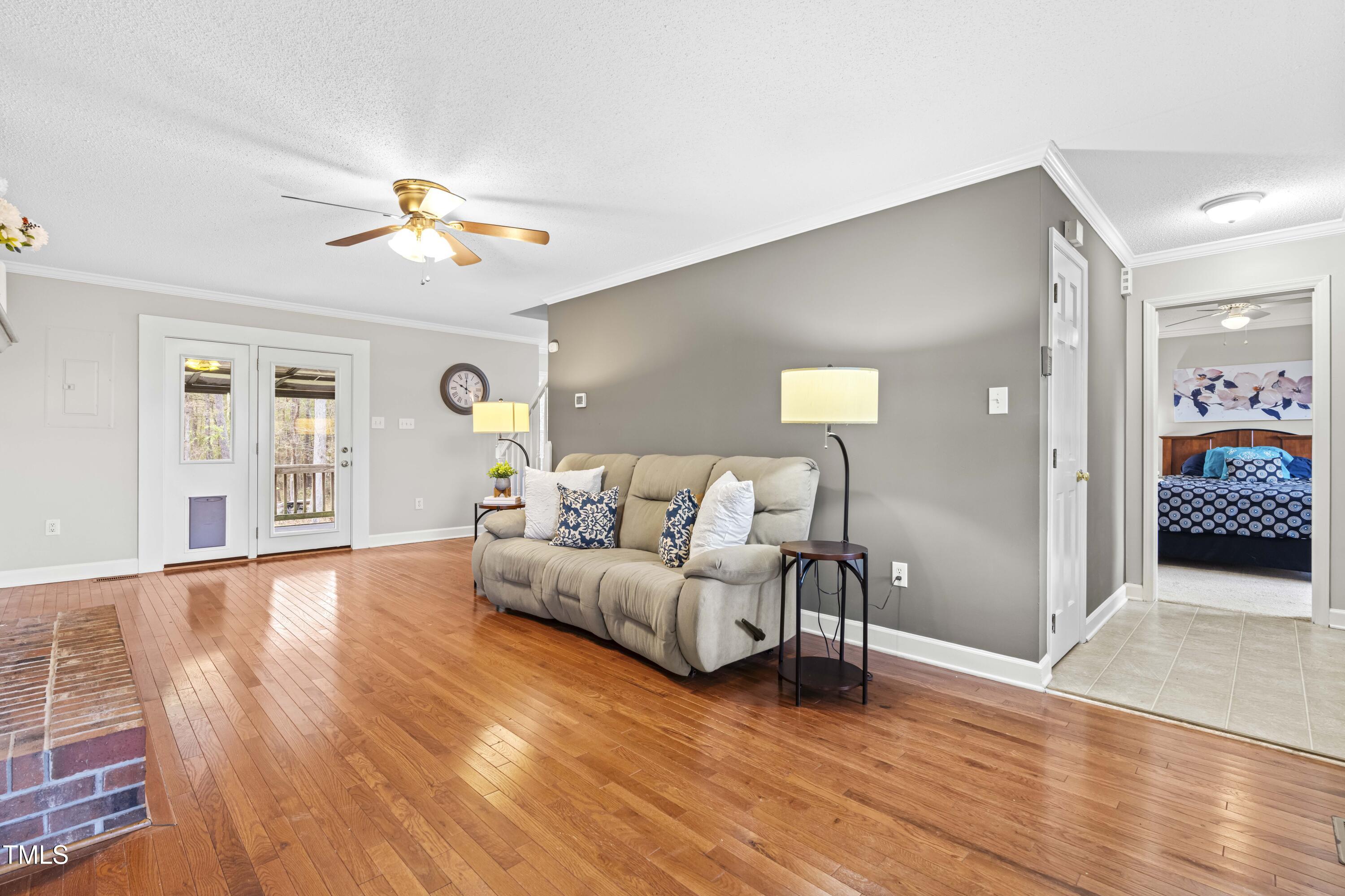 1862 Ranch Road Clayton, NC 27520 - Photo 6 of 26 a living room with furniture and wooden floor