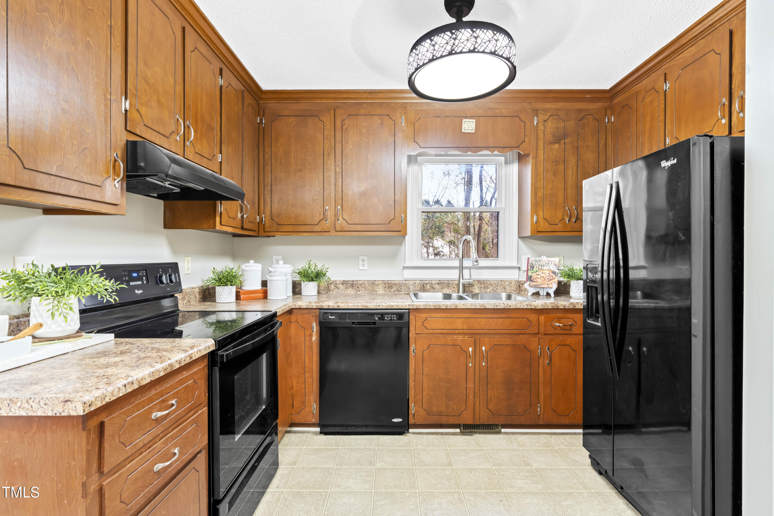 1862 Ranch Road Clayton, NC 27520 - Photo 8 of 26 a kitchen with stainless steel appliances granite countertop a stove a refrigerator and a sink