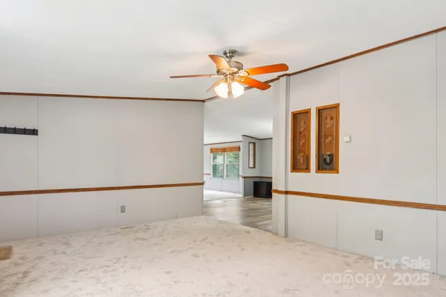 a view of a hallway with a chandelier