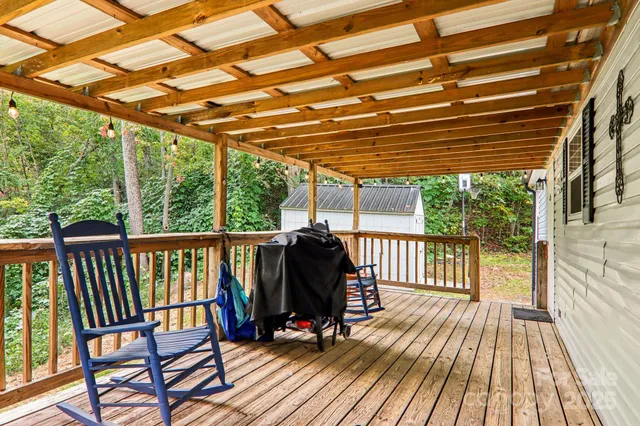 a view of deck with wooden floor and outdoor seating