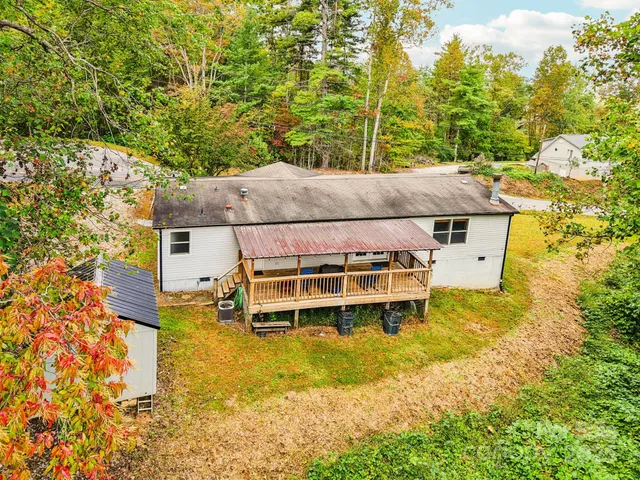 a view of a swimming pool with chairs