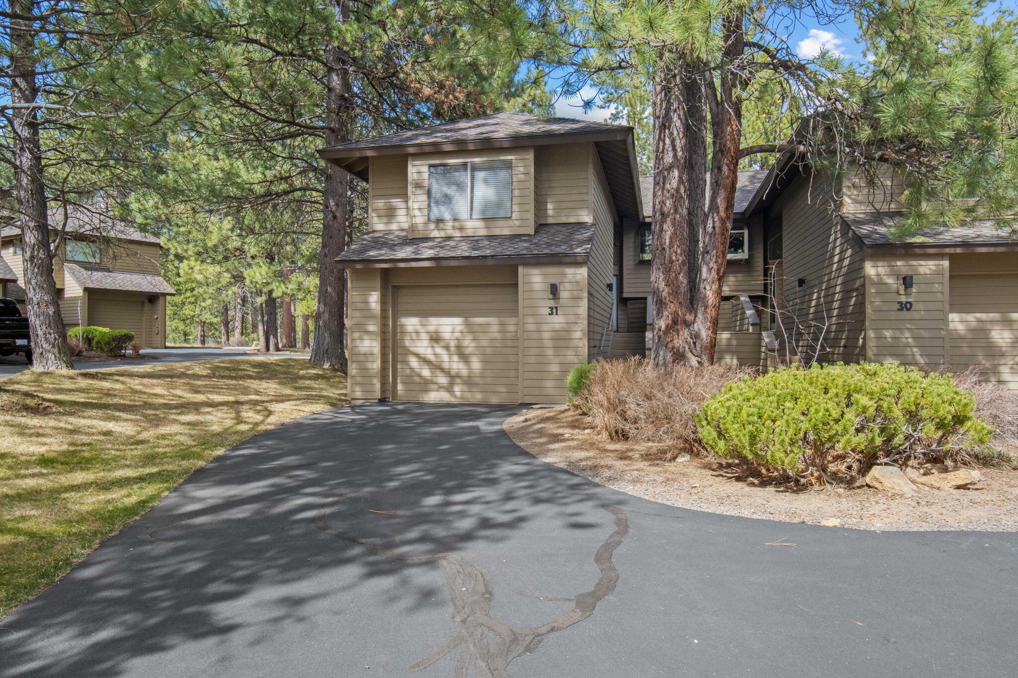 17682 Bittern Lane, Unit 31 Sunriver, OR 97707 - Photo 3 of 44 a front view of a house with garden