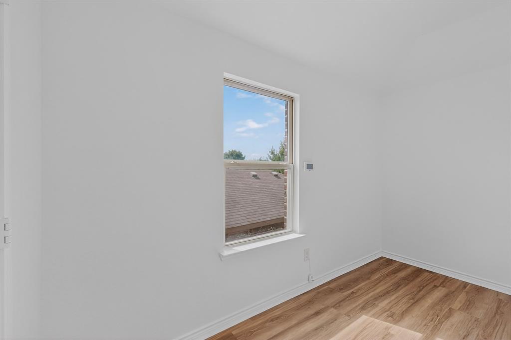 426 Harding Lane Lavon, TX 75166 - Photo 25 of 40 Bright interior space with wood-finish flooring and a white trim baseboard