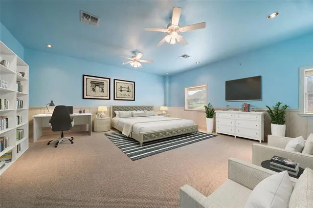 a bedroom with a bed window and a couch