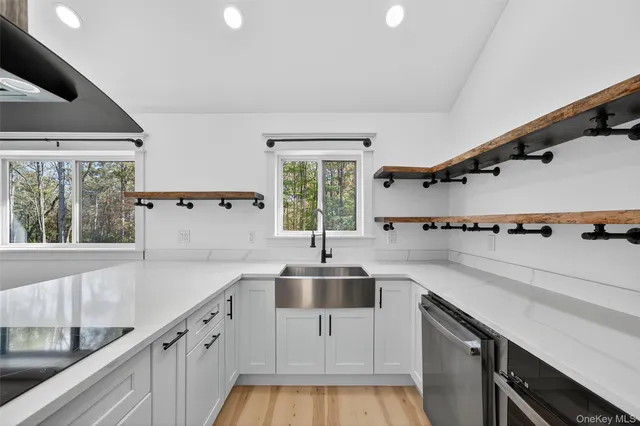 a kitchen with a sink and a large window