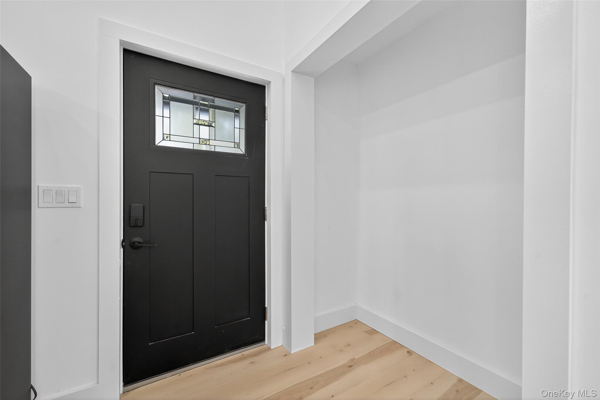 273 Perry Pond Road Narrowsburg, NY 12764 - Photo 16 of 49 Entryway featuring light wood-style flooring and baseboards