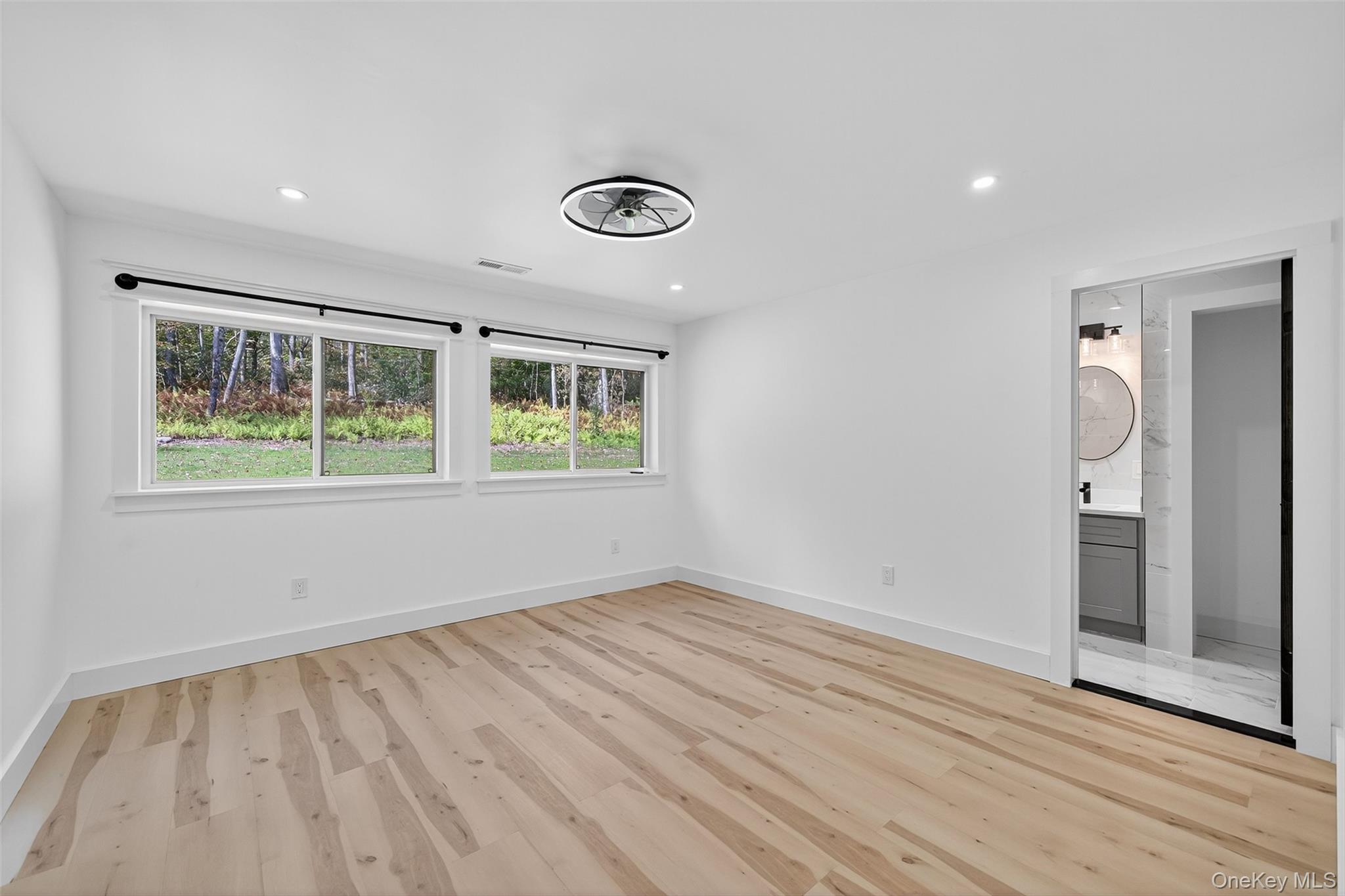 273 Perry Pond Road Narrowsburg, NY 12764 - Photo 25 of 49 Unfurnished bedroom with light wood-style floors, recessed lighting, and ensuite bath