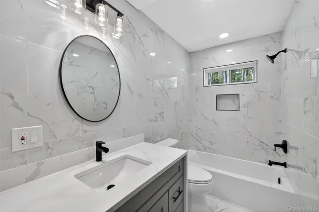 a view of a closet area with wooden floor
