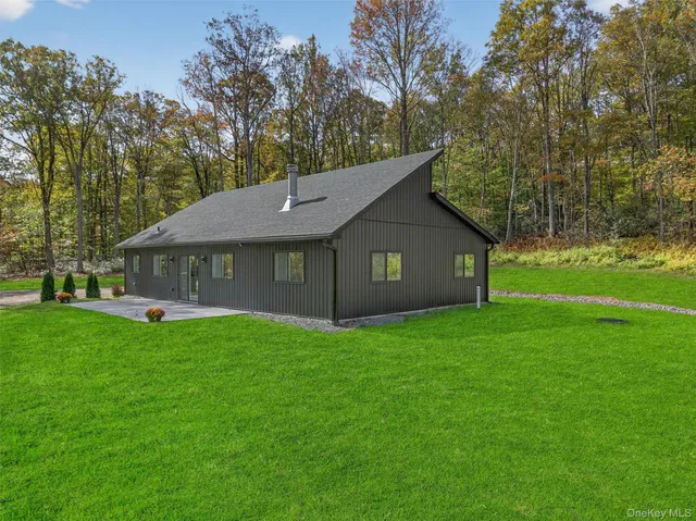 a backyard of a house with wooden fence
