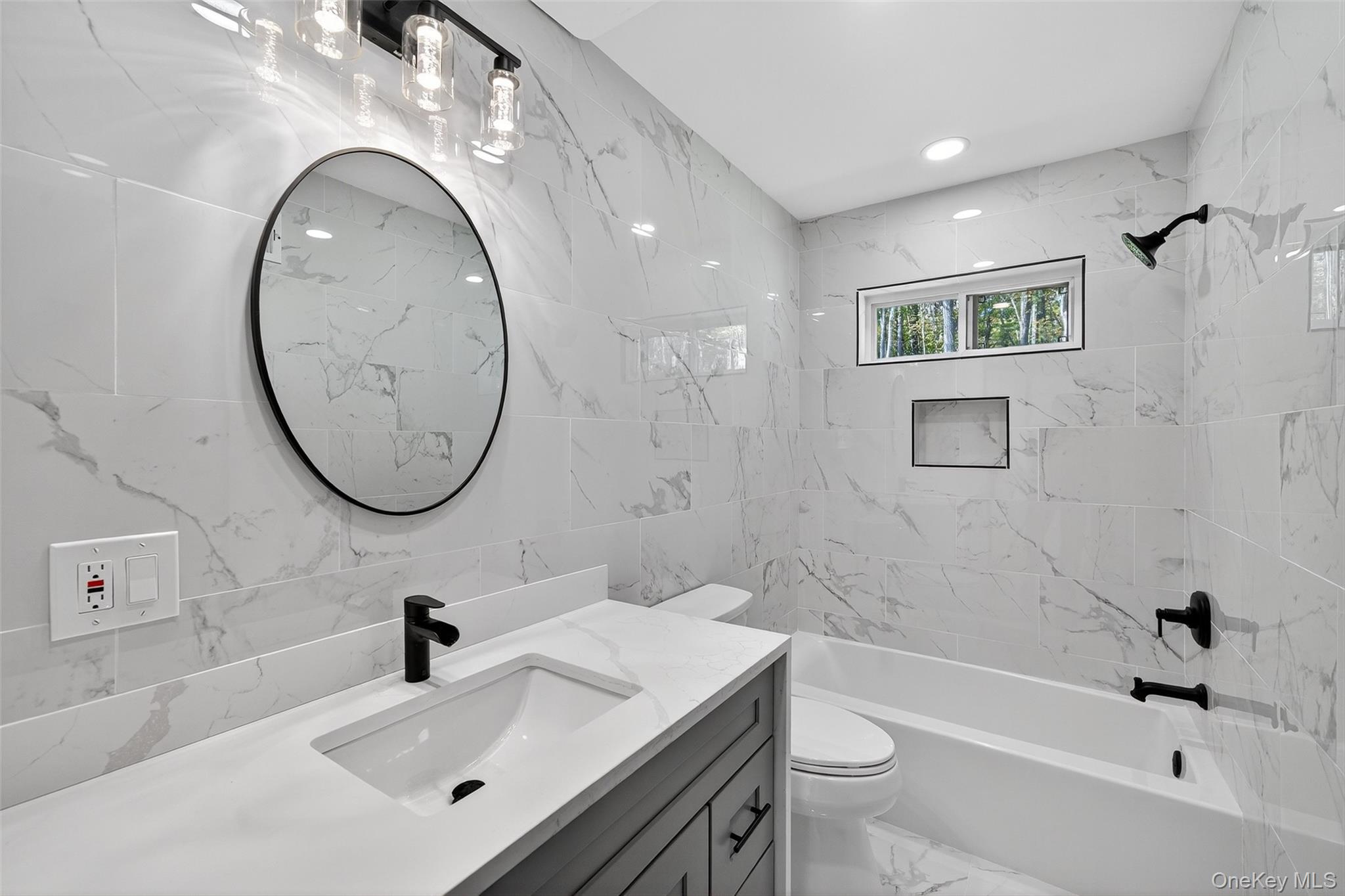 273 Perry Pond Road Narrowsburg, NY 12764 - Photo 36 of 49 Full bathroom featuring tile walls, tub / shower combination, and vanity