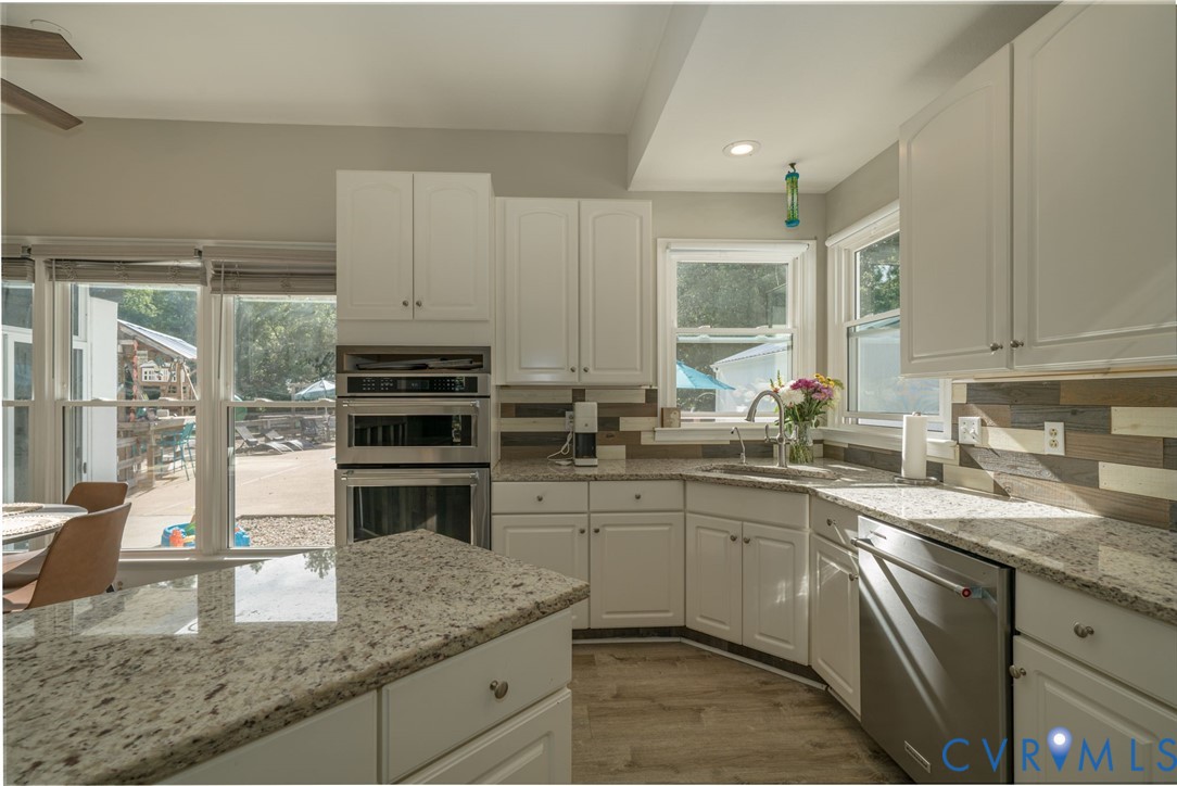 12700 Coalboro Road Chesterfield, VA 23838 - Photo 11 of 50 Contemporary kitchen featuring white cabinetry, li