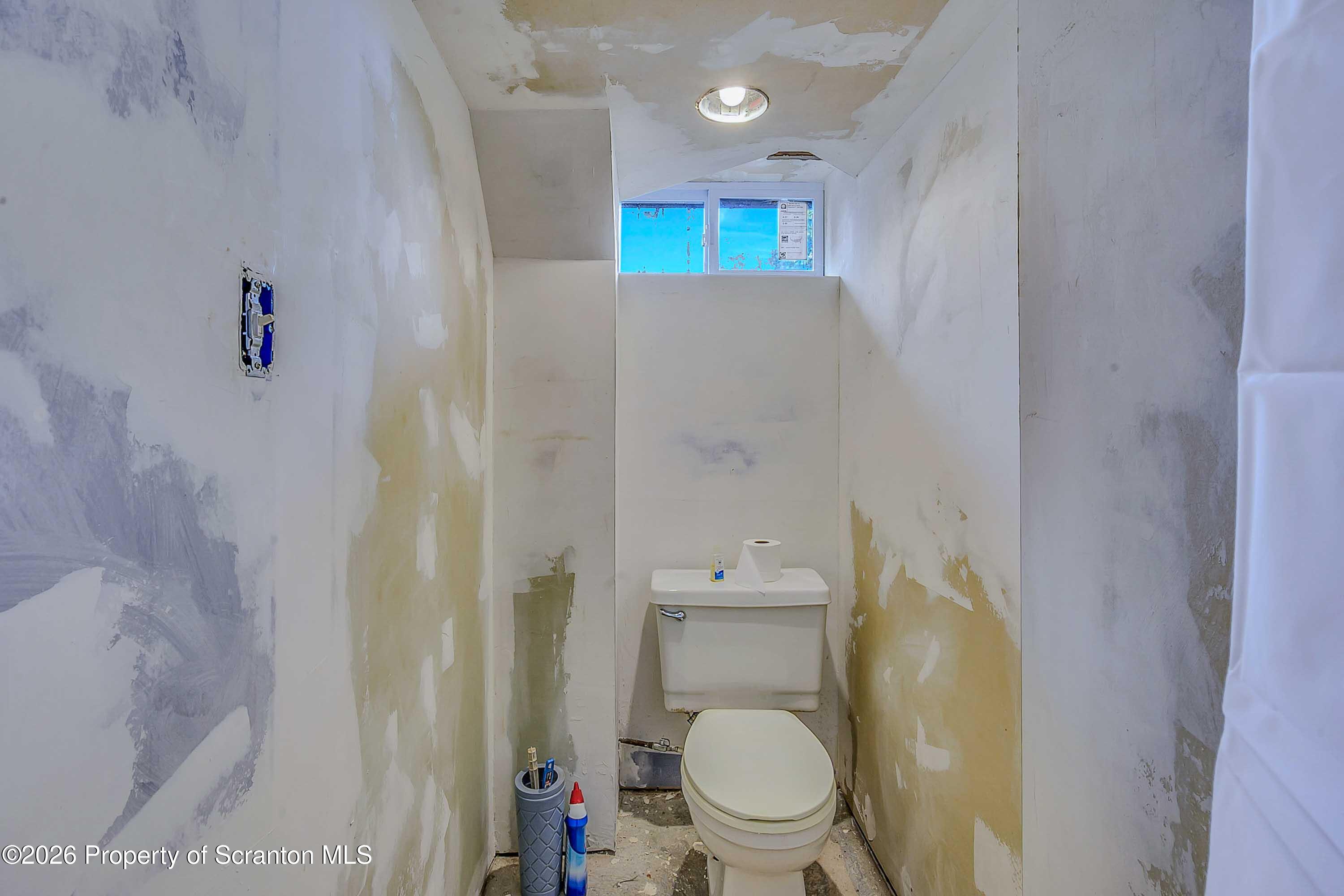 211 Green Street Dunmore, PA 18512 - Photo 30 of 38 a white toilet sitting next to a shower