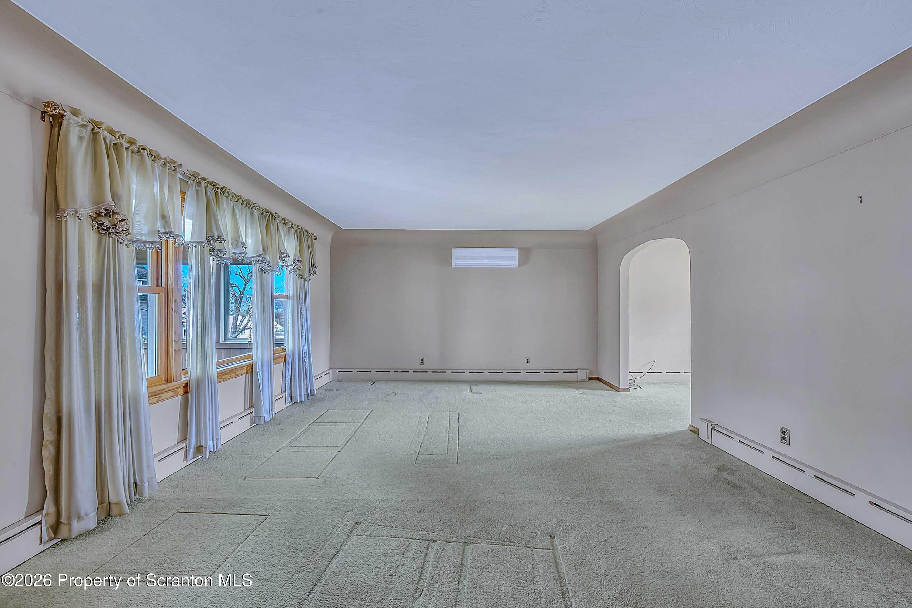 211 Green Street Dunmore, PA 18512 - Photo 3 of 38 a view of an empty room with a window