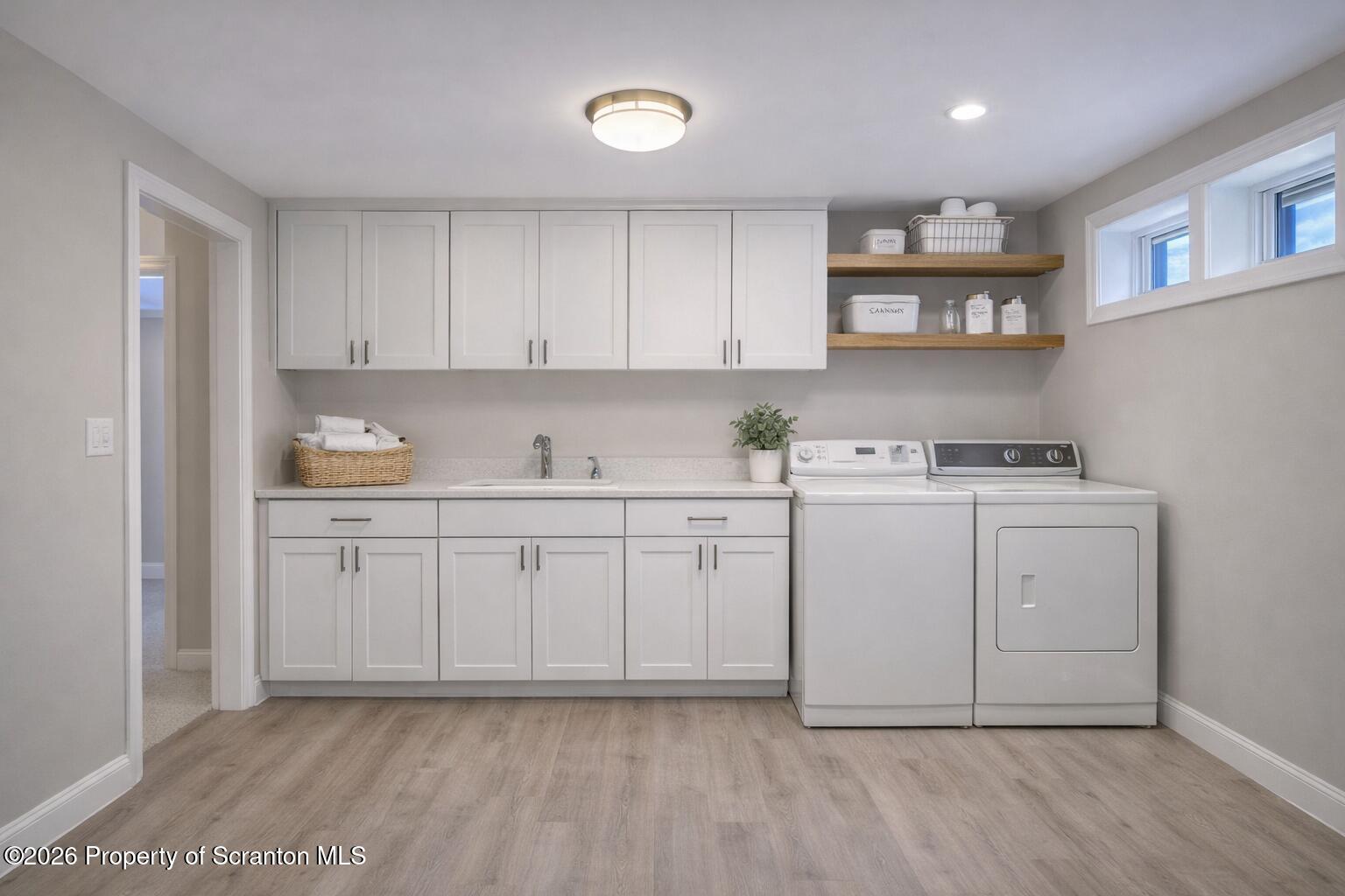 211 Green Street Dunmore, PA 18512 - Photo 32 of 38 a room with a white cabinets and sink