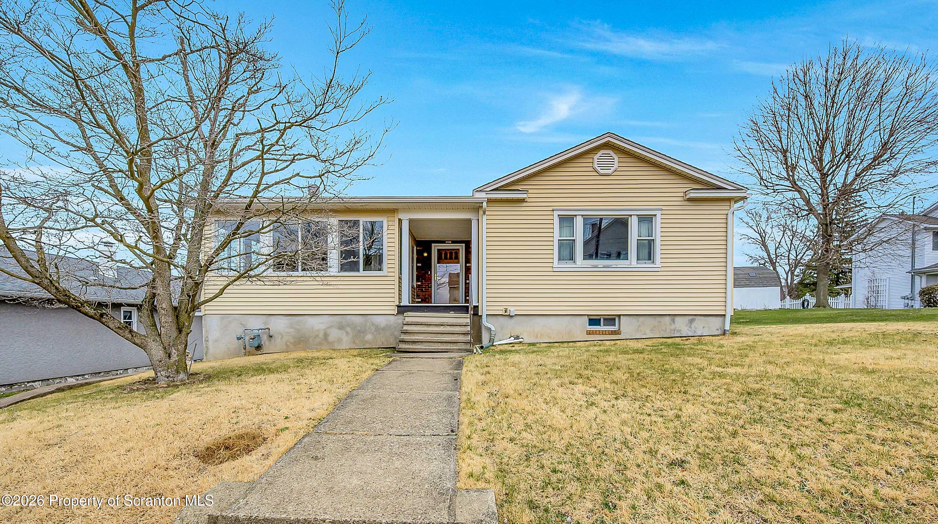 211 Green Street Dunmore, PA 18512 - Photo 35 of 38 a front view of a house with a yard
