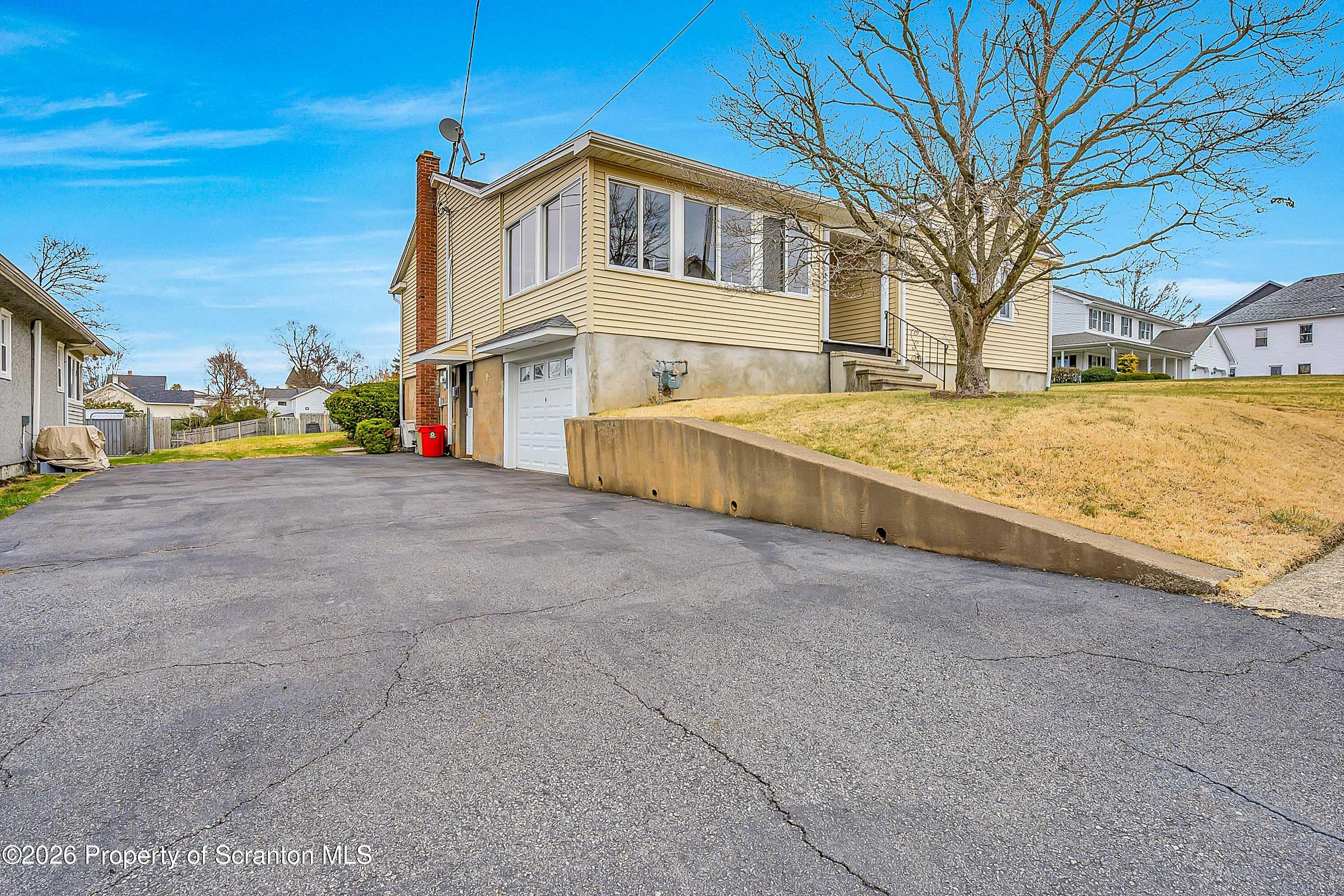 211 Green Street Dunmore, PA 18512 - Photo 37 of 38 a view of an house with backyard and road