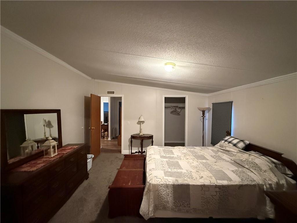 1106 Gary Road Rockwood, PA 15557 - Photo 17 of 46 a bed room with a bed and a large mirror