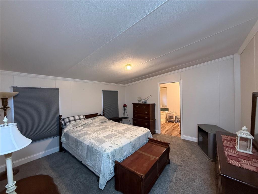 1106 Gary Road Rockwood, PA 15557 - Photo 18 of 46 a bedroom with a bed and a television in it