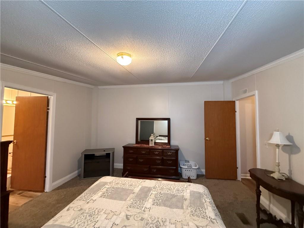 1106 Gary Road Rockwood, PA 15557 - Photo 19 of 46 a bed room with a bed and a television