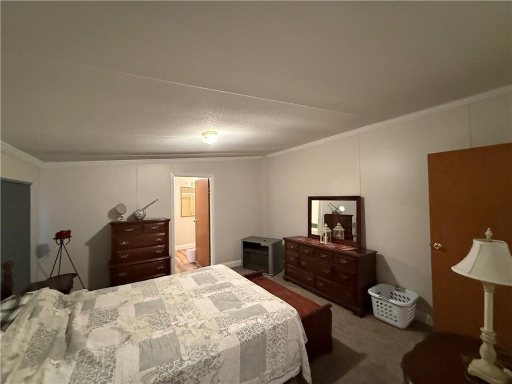 1106 Gary Road Rockwood, PA 15557 - Photo 20 of 46 a bedroom with a bed and a dresser